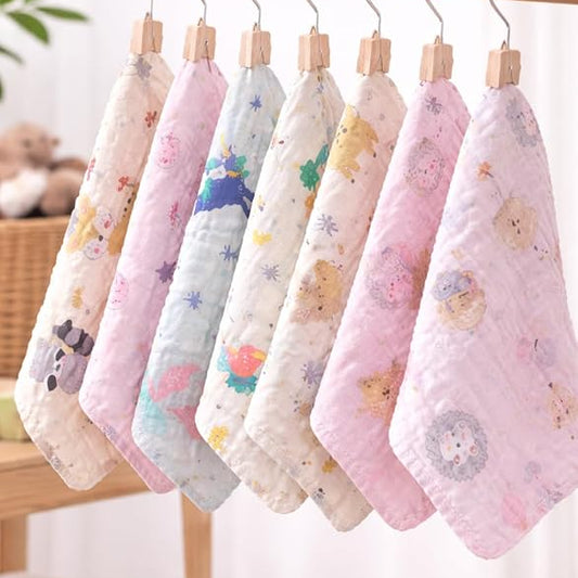 Set of colorful baby blankets with cartoon designs hanging on a rack.