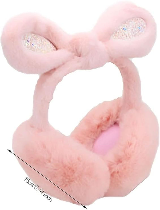 Pink plush dumbbell-shaped toy with rhinestone accents on a white background
