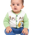 Baby wearing a green and white outfit with a lion design on a white background