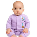 Baby wearing a purple onesie with cartoon character on a white background