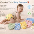 Baby wearing colorful cloth diapers with text highlighting features on a light background