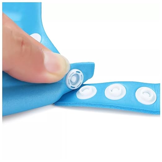 Blue adhesive strip with white dots being peeled off by a finger on a white background