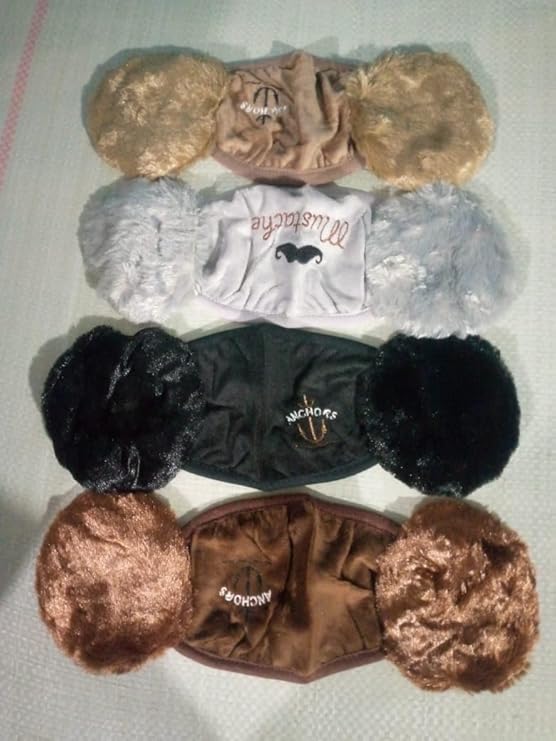 Collection of dog toys with fluffy ends on a light background
