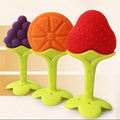 Colorful baby teether toys shaped like fruits on a white background