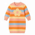 Colorful striped dress with a flower design on a white background