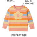 Colorful striped sweater with a flower design on a white background