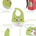 Green baby bib with cartoon design and text on a white background