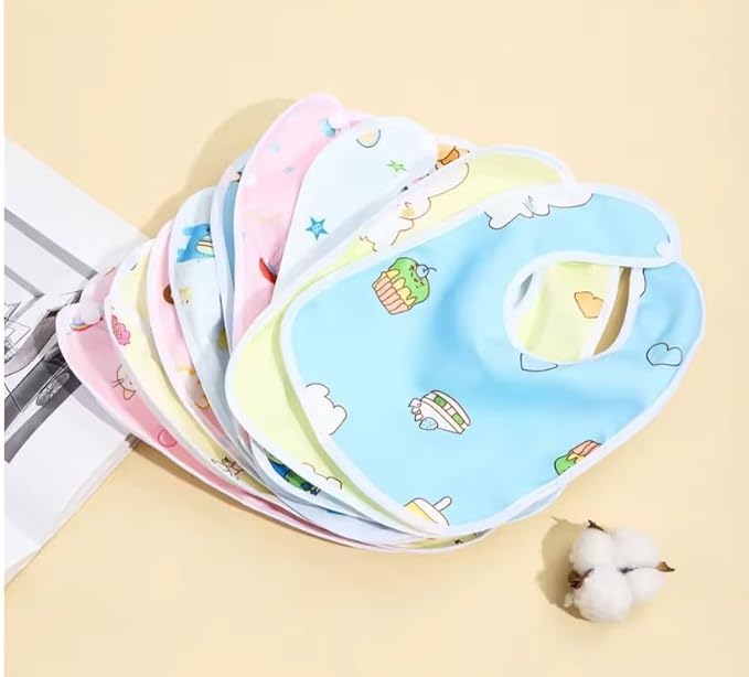 Set of colorful baby bibs with cartoon designs on a beige background