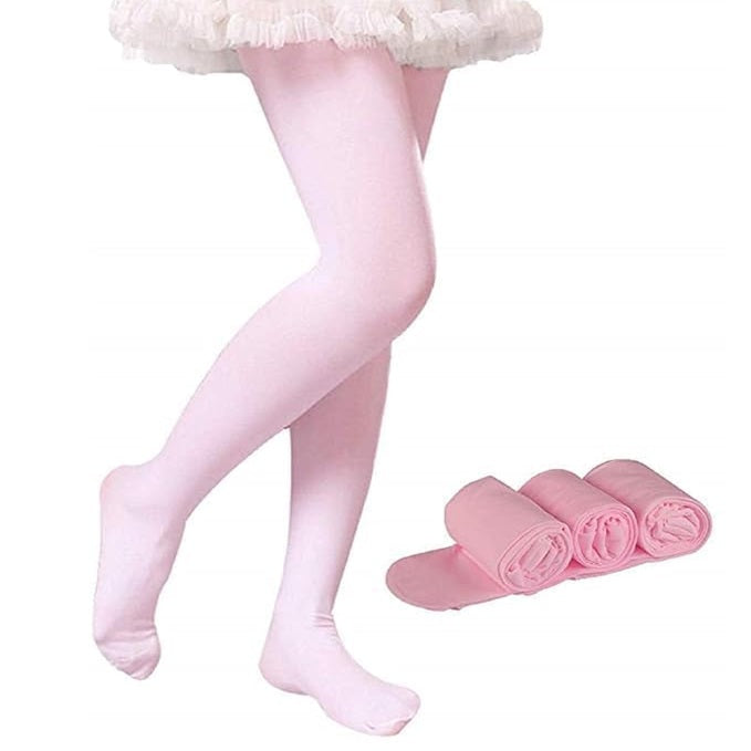 Pink tights worn by a person on a white background with additional pink tights folded and placed nearby.