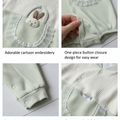 Baby outfit with cartoon embroidery, button closure, open-foot design, and plush fabric on a white background.