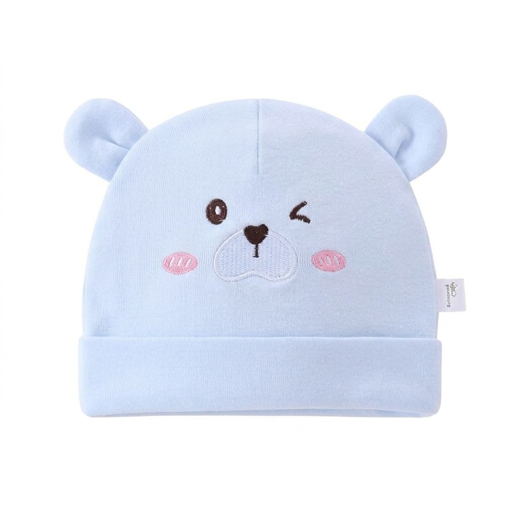 Light blue baby hat with bear ears and face on a white background