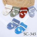 Set of colorful baby socks with animal prints on a white background