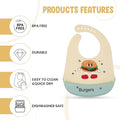 Baby bib with cartoon burger design on a white background with features listed.