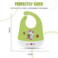Green baby bib with a cartoon design and measurement details on a white background