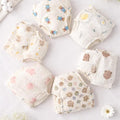 Set of baby bloomers with floral and animal prints on a light background