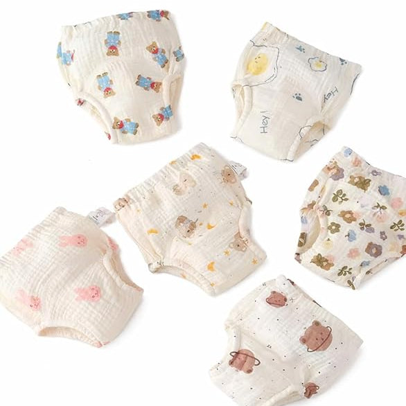 Set of baby diapers with cartoon designs on a white background