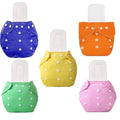 Set of colorful cloth diapers with white button details on a white background