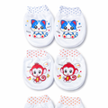 Set of four baby booties with cartoon cat and monkey designs on a white background