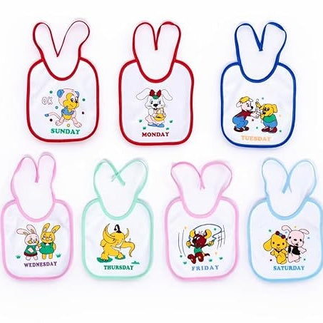 Set of six cartoon-themed bibs with days of the week on a white background