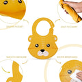 Yellow baby bib with cartoon face design, shown from different angles on a white background.