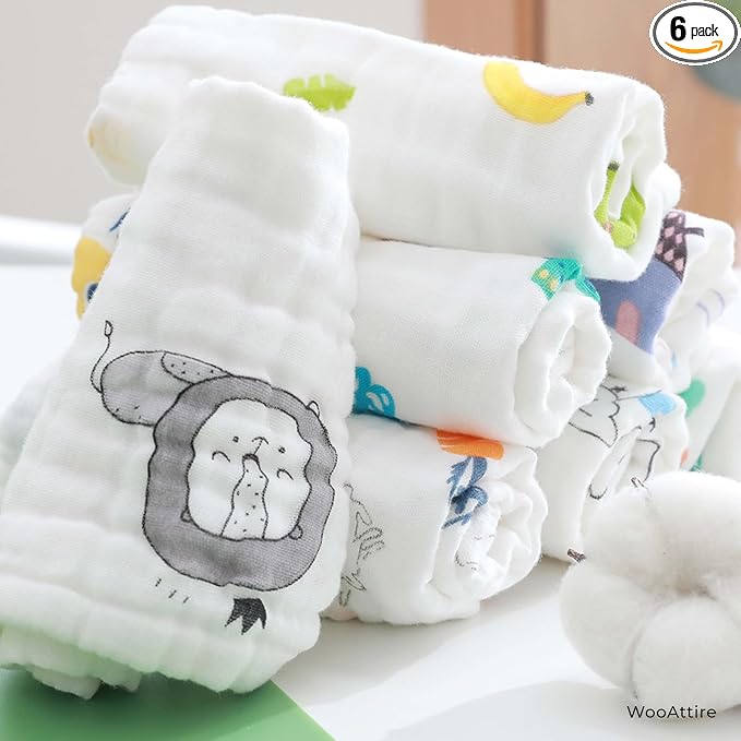 Stack of baby diapers with cartoon designs on a white surface, labeled '6 pack' and 'WooAttire'.