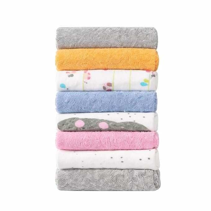 Stack of colorful folded towels on a white background