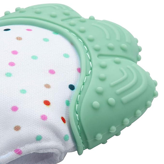 Green teething ring with textured surface and colorful polka dots on a white background