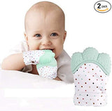 Baby wearing a mint green and white polka dot teething product with another similar product next to it on a white background.