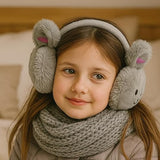 Child wearing gray animal-themed earmuffs and a matching scarf indoors.