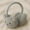 Gray cat-shaped ear muffs on a beige surface